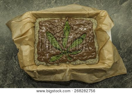 Cooking Of Marijuana Poppy Seed Cake With Chocolate And Pink Fruit Glaze