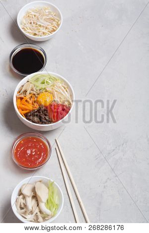 Traditional Korean Bibimbap Dish With Rice And Vegetables On Top