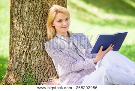 Female Self Improvement. Girl Lean On Tree While Relax In Park Sit Grass. Self Improvement Book. Bus