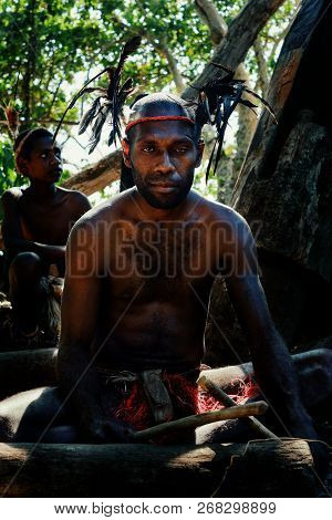 Walarano Village, Malekula Island / Vanuatu - 9 Jul 2016 : Local Tribal Man Drumming In A Feather He