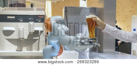 Smart Handy Dexterous Chef Robotic Assistant In Kitchen Technology Concept, Robot Hand Receive An Or