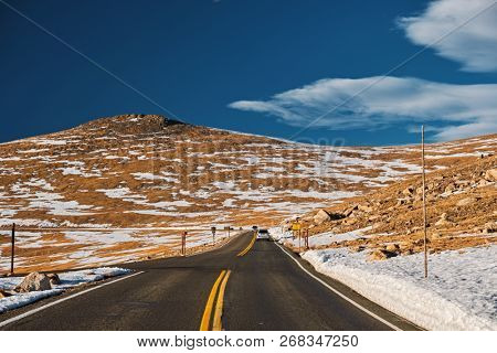 Trail Ridge Road, the highest (12,183 feet) continuous highway in the USA in high alpine tundra with rocks and mountains at autumn. Rocky Mountain National Park in Colorado, USA. 