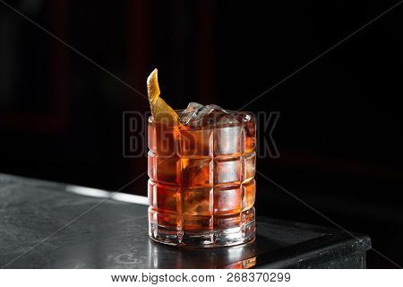 Boulevardie Cocktail On A Bar Desk. Black Background