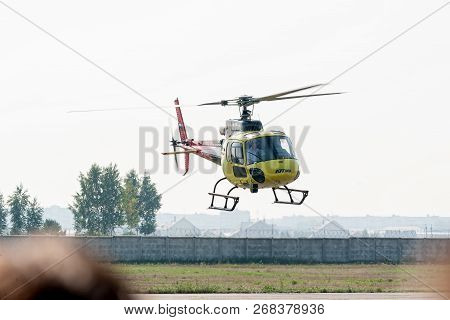 Tyumen, Russia - August 11, 2012: On A Visit At Utair Airshow In Heliport Plehanovo. Pilot Of Robins