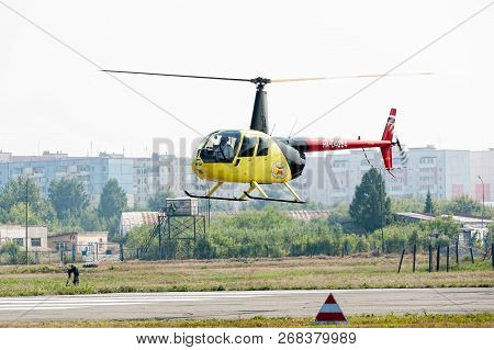 Tyumen, Russia - August 11, 2012: On A Visit At Utair Airshow In Heliport Plehanovo. Pilot Of Robins
