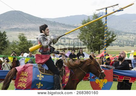 Tlaxcala, Mexico- September 29, 2018: Young Knight With Red Clothes Riding A Horse During Medieval T