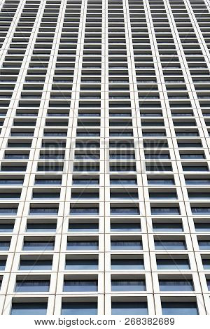 Bottom View Glass Grey Square Windows Of Modern City Business Building Skyscraper. Receding Perspect