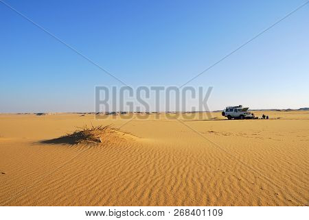 Sahara Desert Safari Off-road Vehicle Parking For Camp Into The Sand Desert Nearby Dakhla Oasis In E