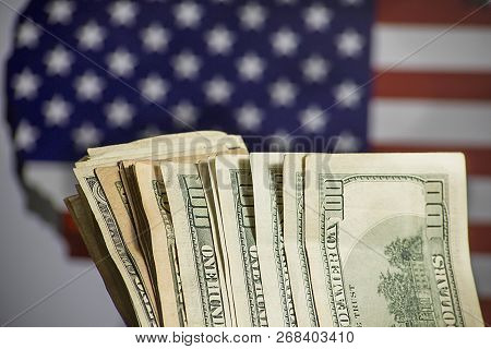The Dream Of Traveling To The United States- Dollars With American Flag In The Background