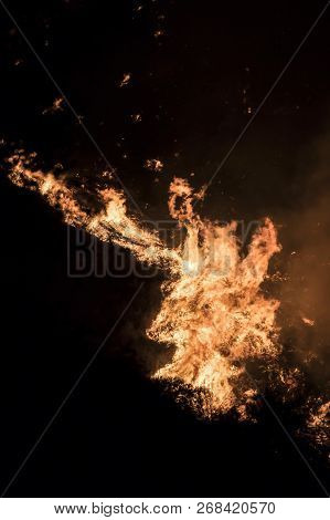 Close Up Detail Orange Flames At Night Twisting And Creating Shapes During California Fires.