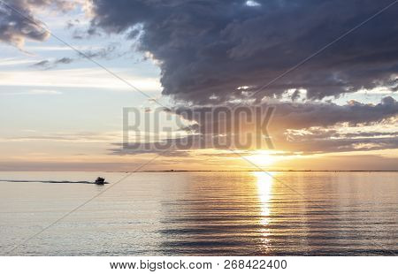 Amazing Sunset Over The Sea With Dramatic Clouds