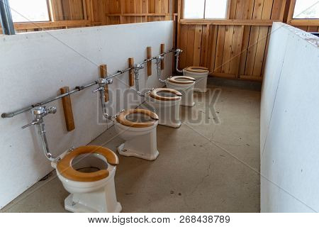 Rows Of Exposed Toliets In The Bathrooms At The Manzanar Japanese Internment Camp In Independence Ca