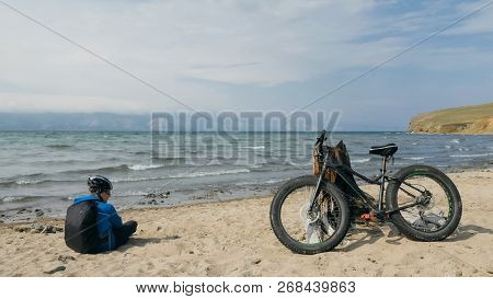 Fat Bike Also Called Fatbike Or Fat-tire Bike In Summer Driving On The Beach.