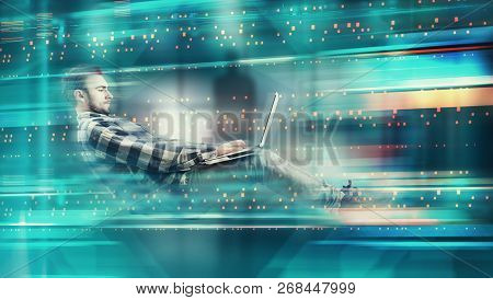Man Working On Laptop In Futuristic Digital Backgroud. High Speed Browsing .