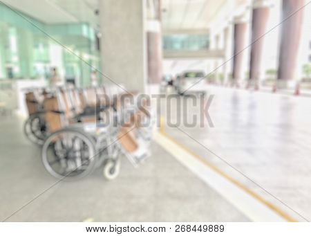 Disability Mobility Care Service Concept With Blur Wheelchairs And Stretchers Background In Front Of