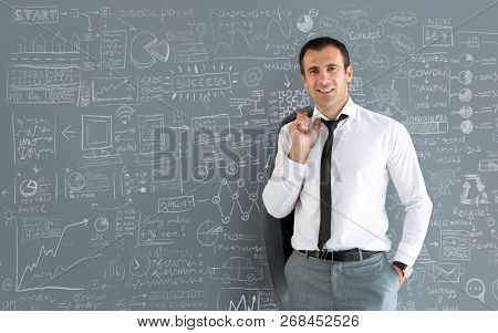 Nonchalant male model posing with jacket over shoulder 