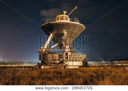 Radio Telescope Satellite Antenna At Starry Night.