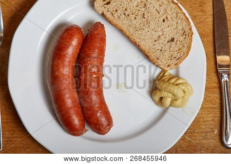 Boiled sasages served on a plate
