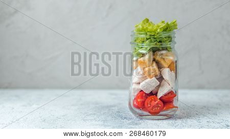 Caesar Salad In Glass Mason Jar On Gray Background. Copy Space For Text. Homemade Healthy Caesar Sal