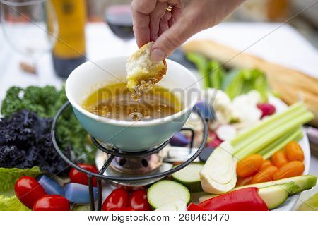 Traditional Italian Dish - Bagna Cauda. Hot Sauce And Raw Vegetables.