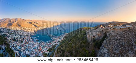 Panoramic View Of Pothia Town, Capital Of Kalymnos, Greece, And Monastery Of Agios Savvas Located On