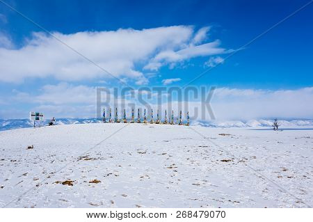 Wooden Ritual Pillars With Colorful Ribbons On Cape Burkhan, Lake Baikal, Olkhon Island, Siberia, Ru