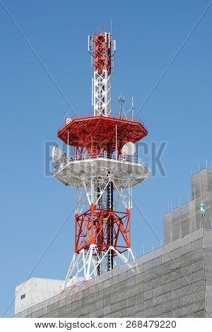 View Of Communication Tower With Antenna Against Blue Sky