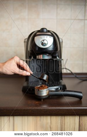 Photo Of Coffee Maker, Human Hand Pouring Coffee Into Mug In Kitchen