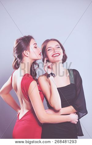 Two young beauty women standing together . Two young beauty wome