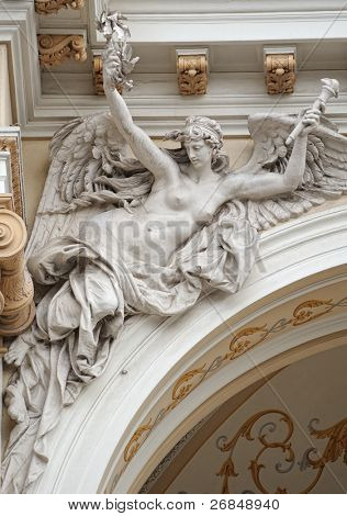 medieval sculpture of a woman angel on the villa