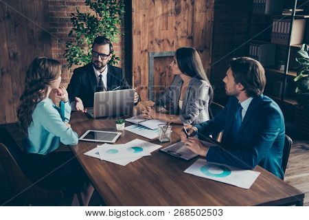 Portratit Of Four Stylish Elegant Classy Chic Confident Professional Business Sharks Sitting At Tabl
