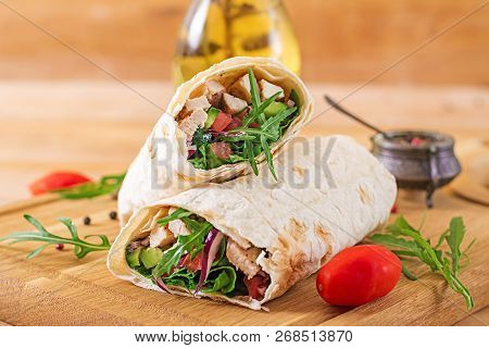 Tortillas Wraps With Chicken And Vegetables On  Wooden Background. Chicken Burrito. Healthy Food.
