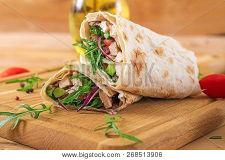 Tortillas Wraps With Chicken And Vegetables On  Wooden Background. Chicken Burrito. Healthy Food.