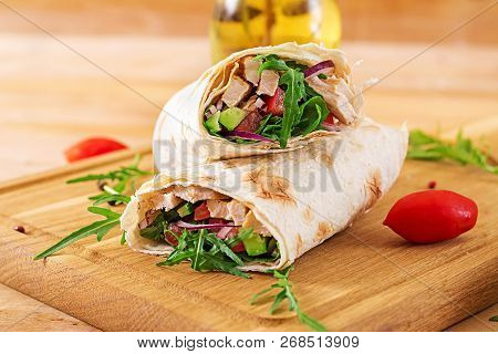 Tortillas Wraps With Chicken And Vegetables On  Wooden Background. Chicken Burrito. Healthy Food.
