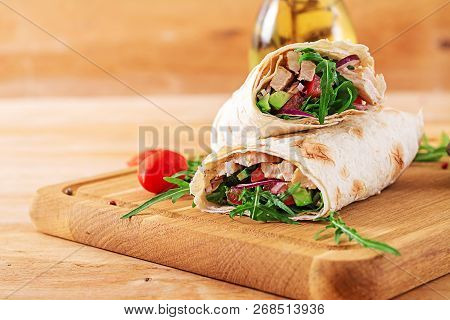 Tortillas Wraps With Chicken And Vegetables On  Wooden Background. Chicken Burrito. Healthy Food.