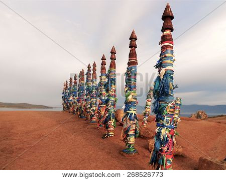 Vivid Colored Ribbons Hadak Tied On Posts Of Wish. Wooden Ritual Pillars. Sacred Place Of Buddhist S