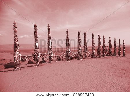 Vivid Colored Ribbons Hadak Tied On Posts Of Wish. Wooden Ritual Pillars. Sacred Place Of Buddhist S