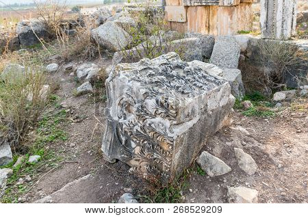 The Remains Of The Column On The Ruins Of The Destroyed Roman Temple, Located In The Fortified City 