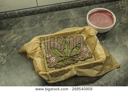Cooking Of Marijuana Poppy Seed Cake With Chocolate And Pink Fruit Glaze