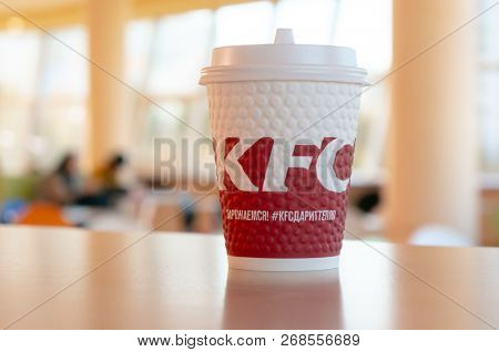 Moscow, Russia, October 11, 2018 : Coffee in paper cups with KFC logo on the table at KFC