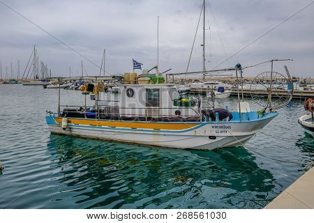Zygi, Cyprus - June 16, 2018: Side View Of A Single Authentic Fishing Boat Which Is Moored In The Ha