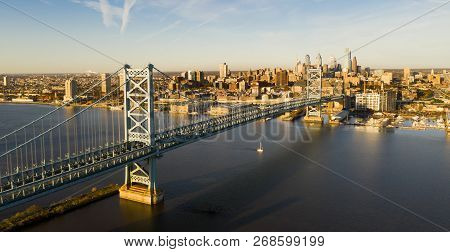 Blue Sky Over The Benjamin Franklin Bridge Into Downtown Philadelphia Pennsylvania