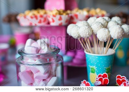 Marshmallow, Sweet Colored Meringues, Popcorn, Custard Cakes And Cake Pops On Table