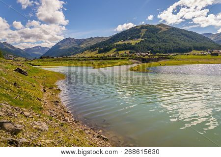 Beautiful Summer Landscape With Vetta Blesaccia Mountain Peak And Lake Livigno, Italy, Sunny Day