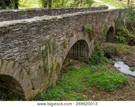Arches Of An Old Stone Bridge (called Ponte Aspera) - Sarria, Galicia, Spain