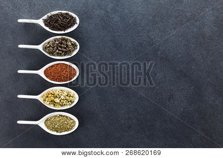 A Variety Of Loose Dried Tea Leaves On Spoons (black, Green, Rooibos, Chamomile And Mate Tea), Photo