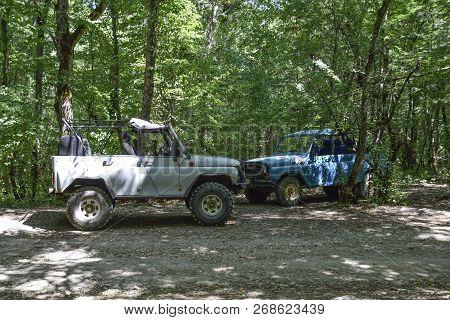 Shapsugskaya, Russia - June 30, 2017: Suv In The Forest. Transport For Hilly And Mountainous Terrain