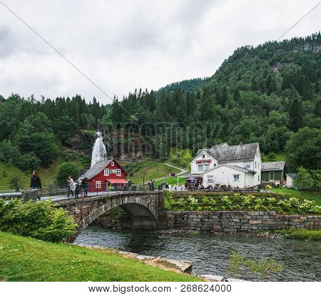 Steine, Norway - August 2, 2018: Steinsdalfossen Waterfall With Souvenir Shop In Steine, Norway