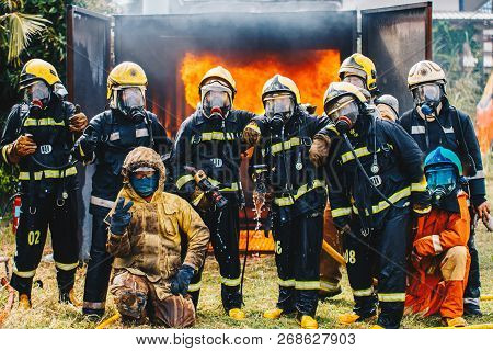 Portrait Of Firefighters Team In Uniform
