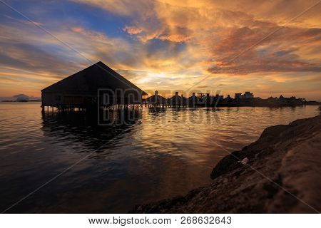 Beautiful Twilight Sunrise With Silhouette Floating Resort In Semporna, Sabah, Borneo (image Contain